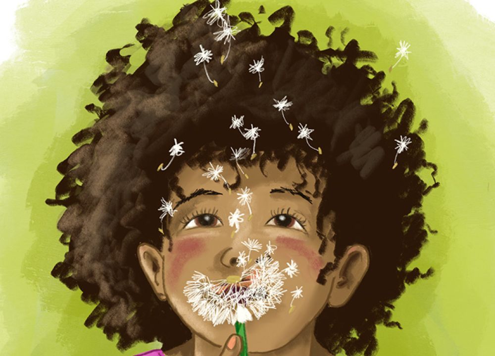 Ein Mädchen pustet eine Pusteblume